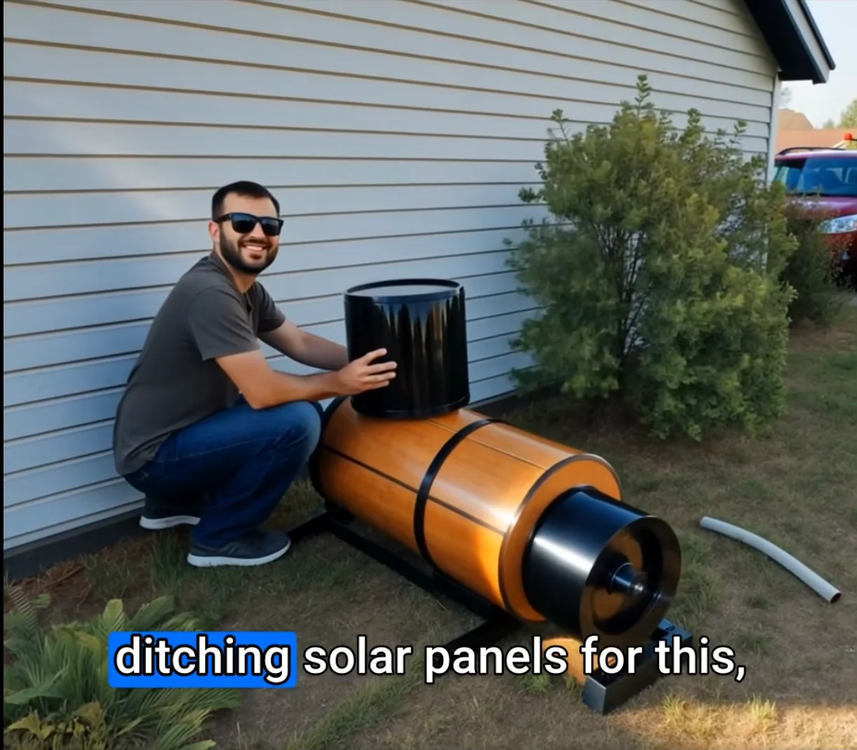 Tom Wilson, 68, standing in his garage workshop next to the compact device